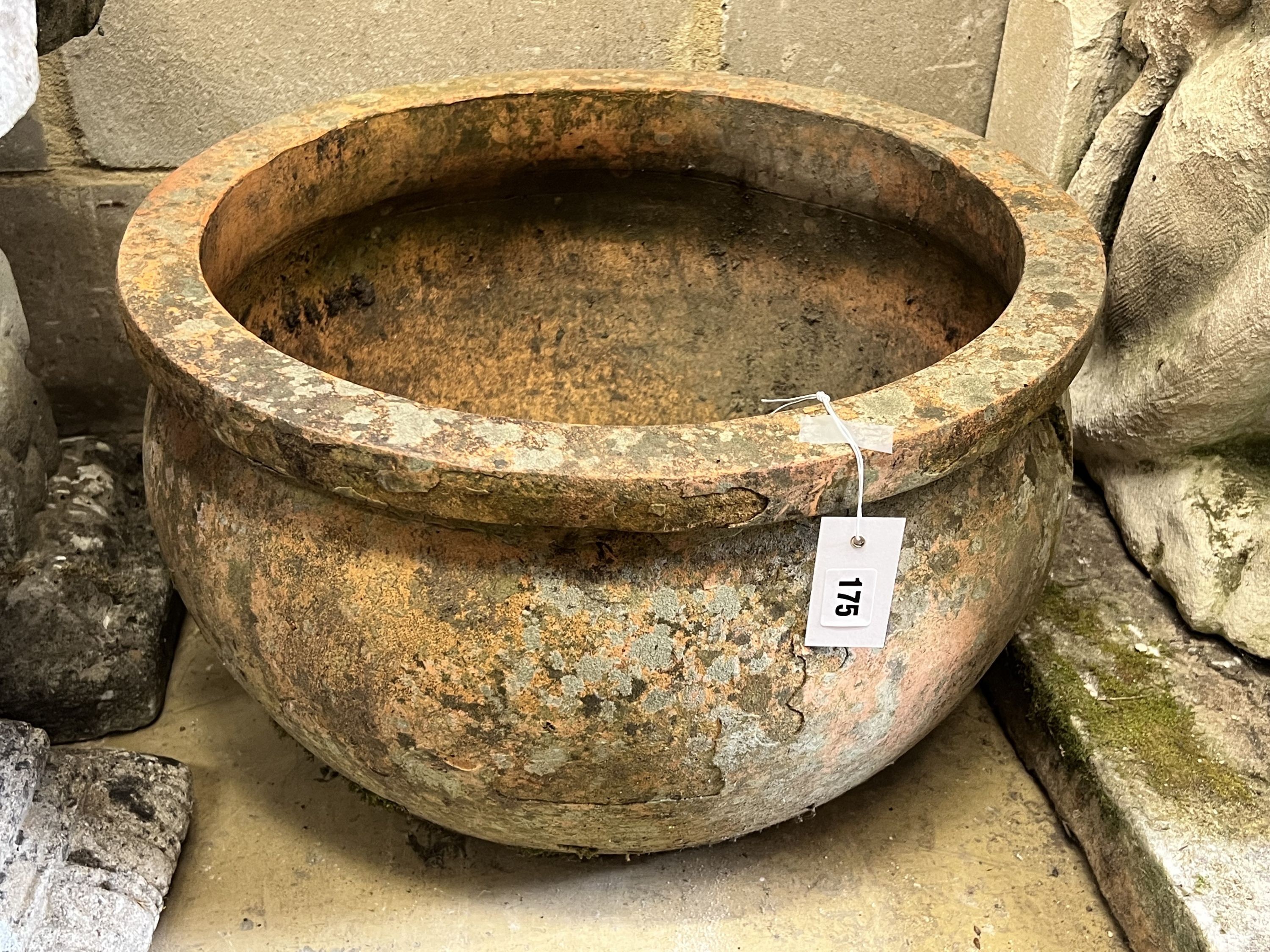 A circular terracotta garden planter, diameter 51cm height 31cm